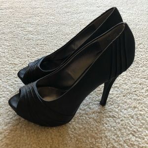 Black open-toed stilettos.